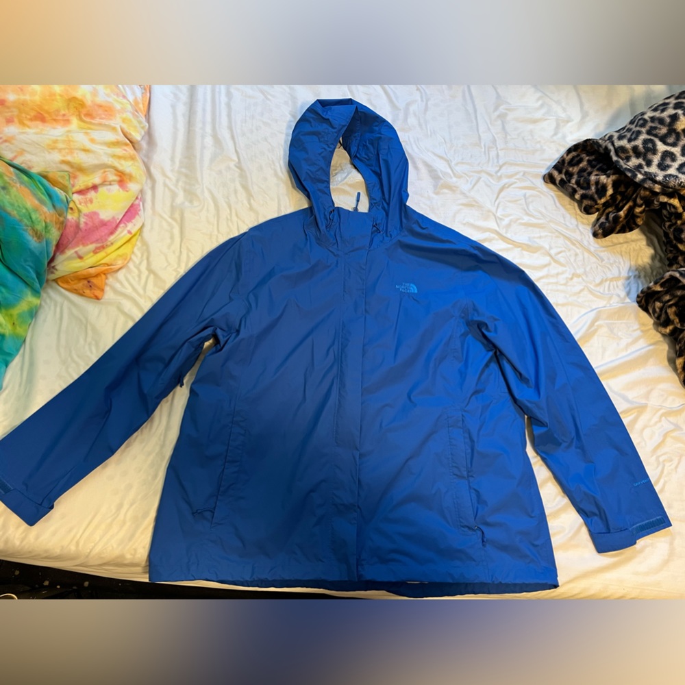 Blue woman’s north face rain jacket